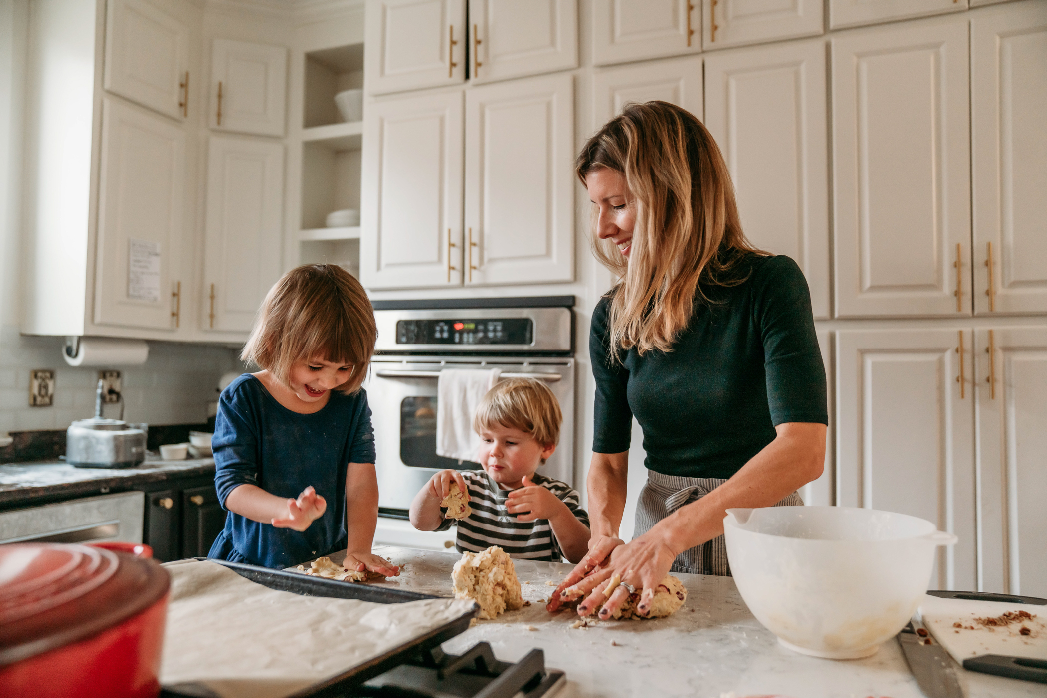 Anna cooking with her children